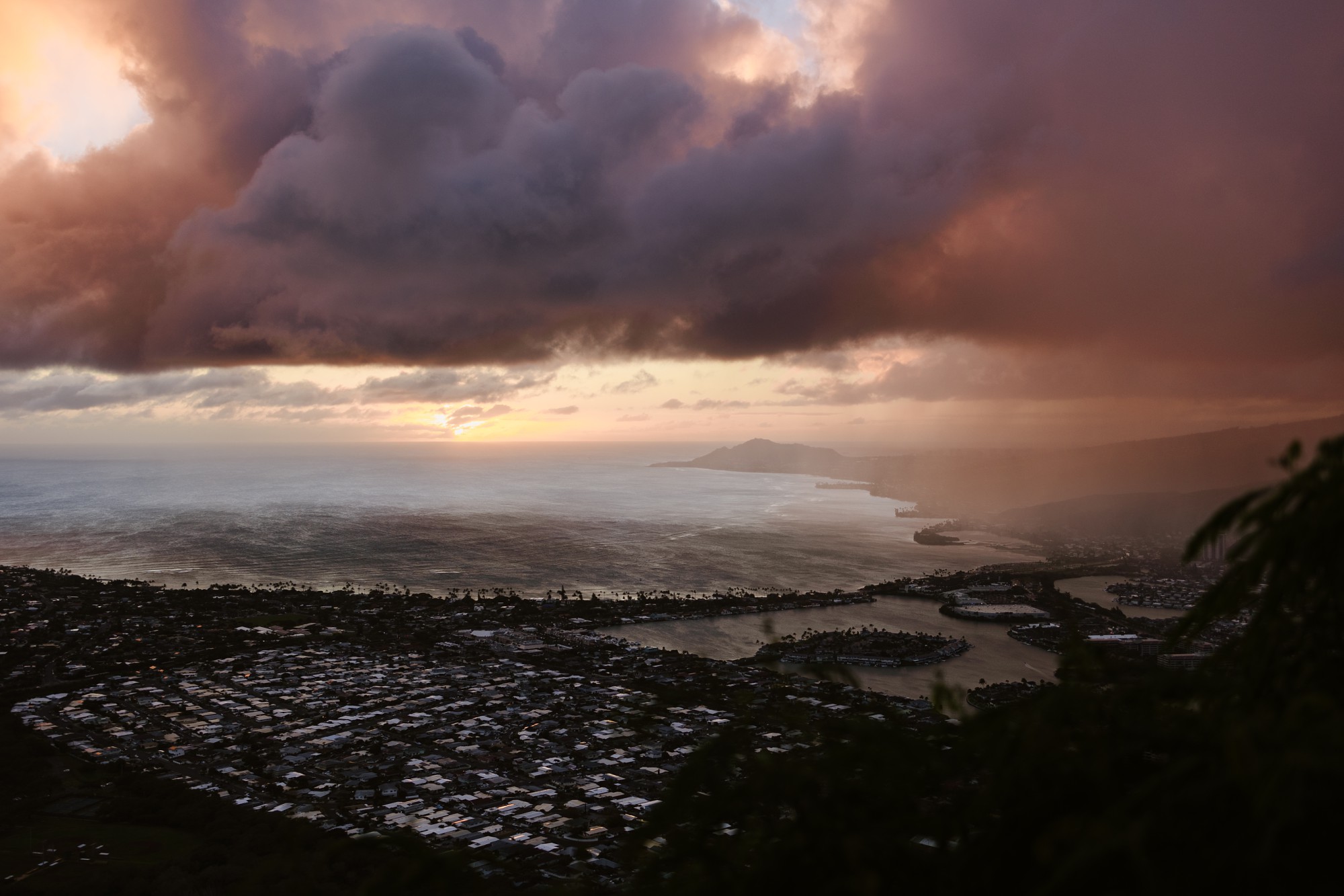 sunset and rain squalls over hawaii kai as viewed from the summit of koko head trail