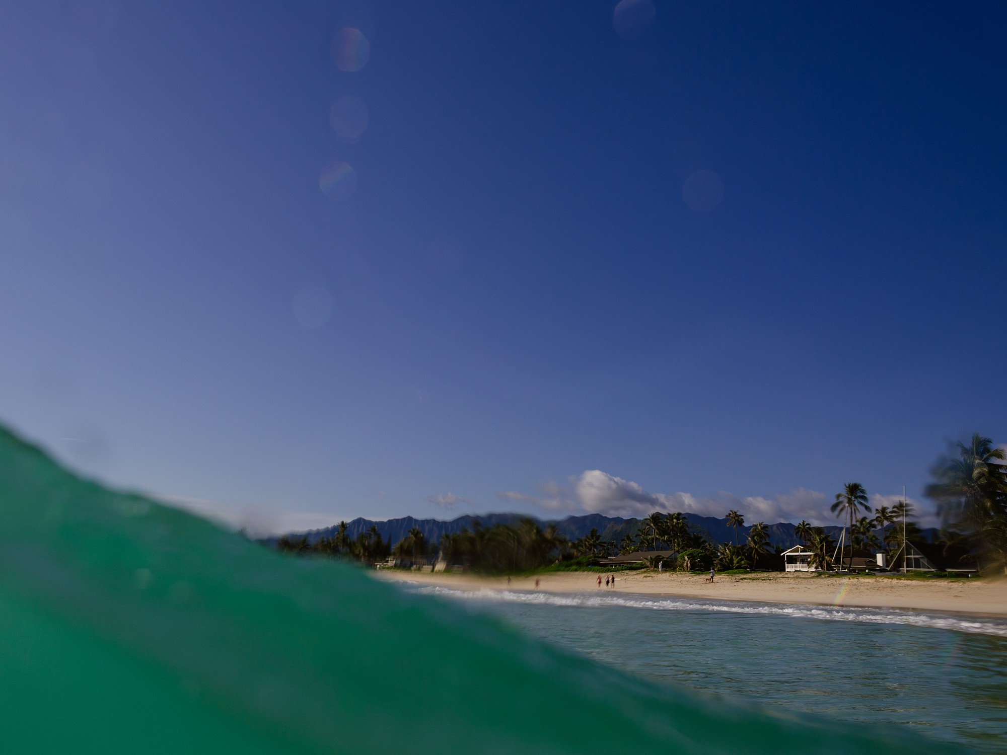 kailua beach as seen from the back of a wave on a clear day