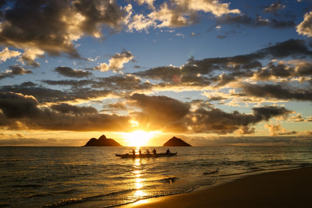 lanikai beach image at sunrise with paddlers