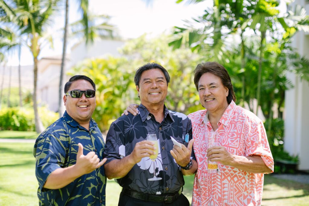 uncles shaka for the camera during an oahu birthday party