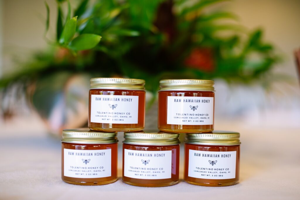 jars of honey as favors during a first birthday luau in hawaii