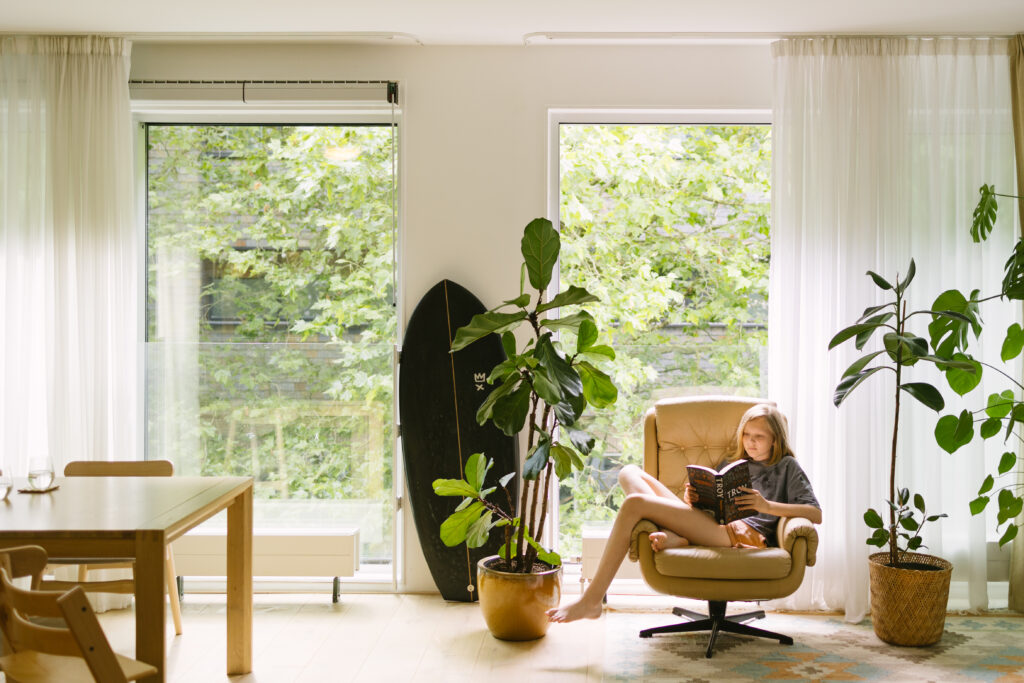 girl reading a book in an amsterdam home exchange