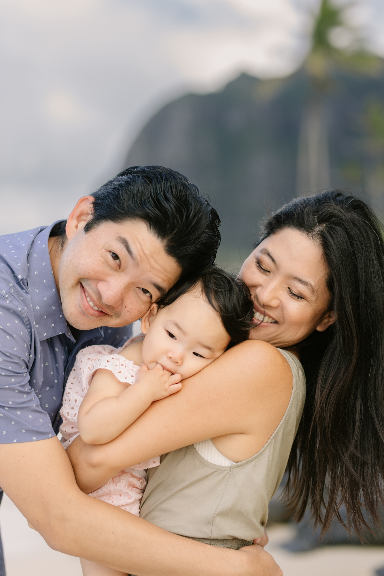 a big hug during kaaawa beach family photos on oahu