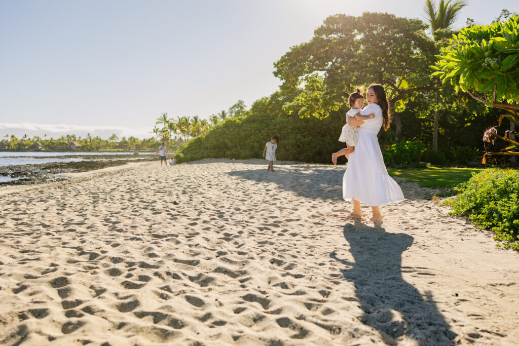 family exploring the coastline outside the Four Seasons Hualalei resort in kona hawaii