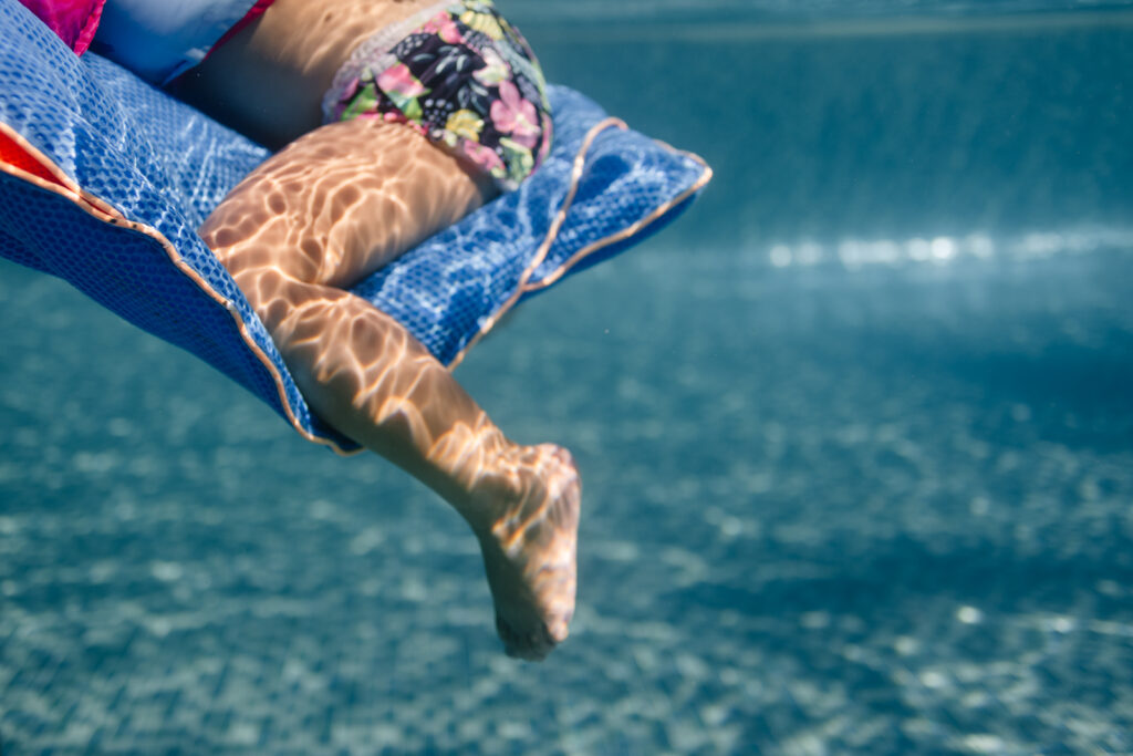 baby floating the pool at the resort