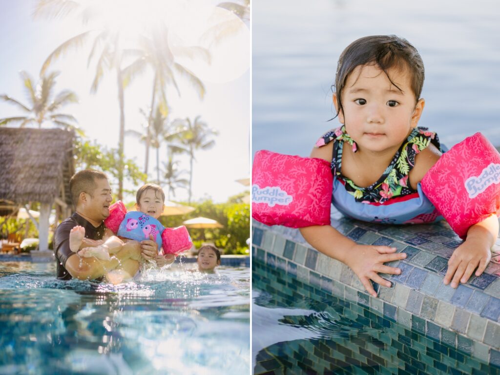 dad playing with kids in the pool at the Four Seasons Resort in Kona